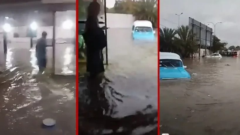 Civil protection teams help people trapped by floodwater in Tunis
